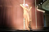 Pink-haired toon stripper performing her passionate dance at the pole